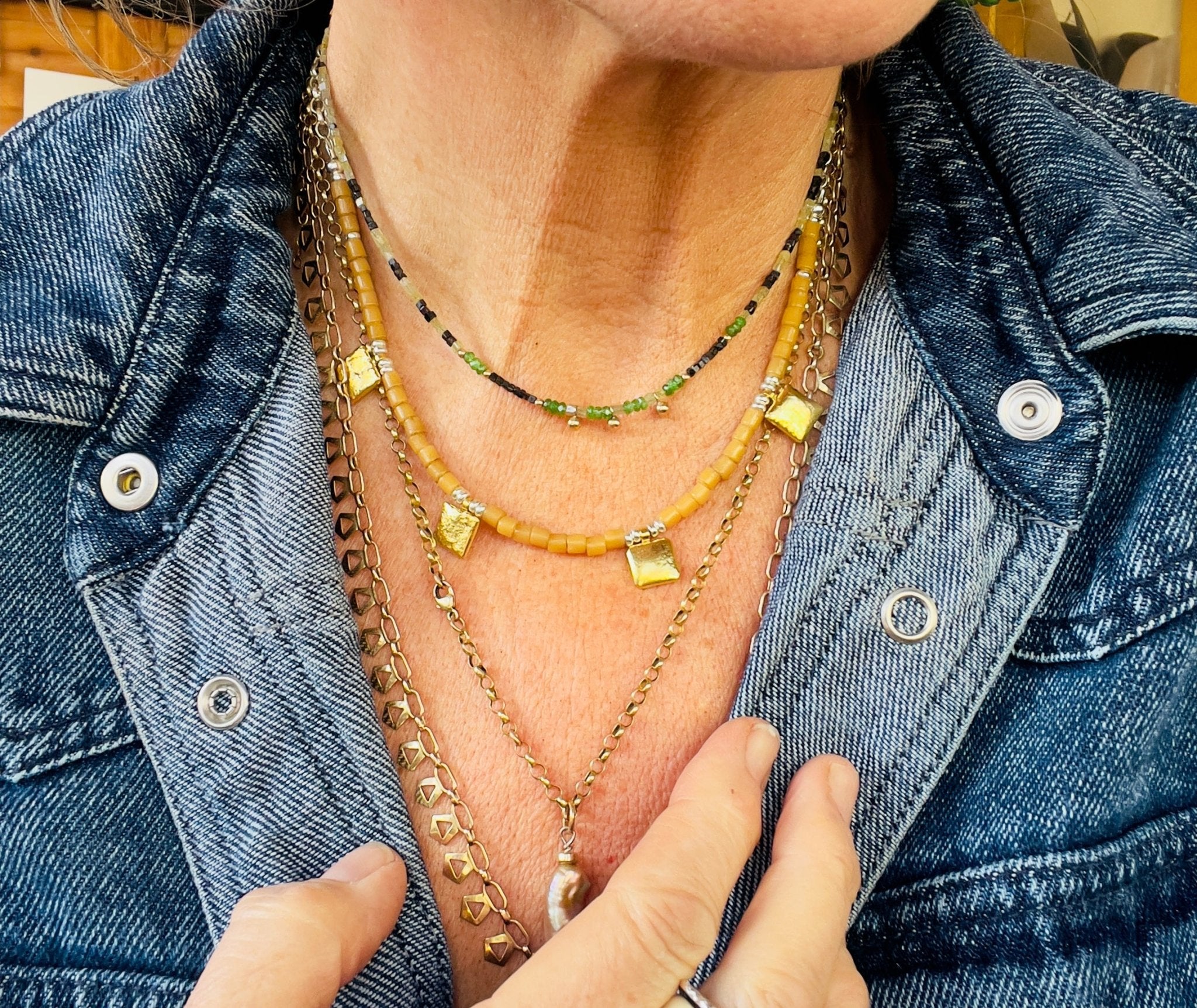 Tan tiles and gold necklace