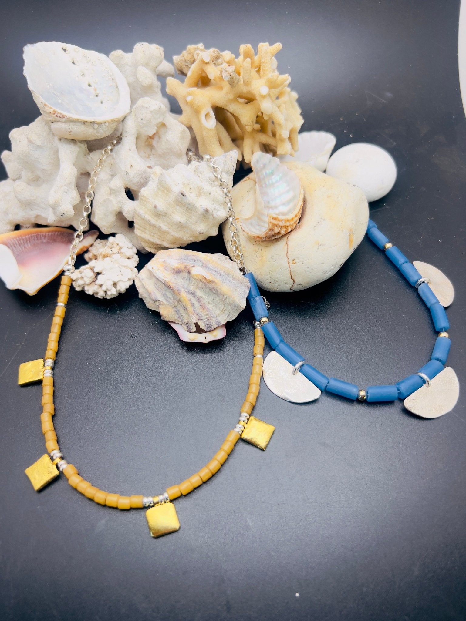 Tan tiles and gold necklace