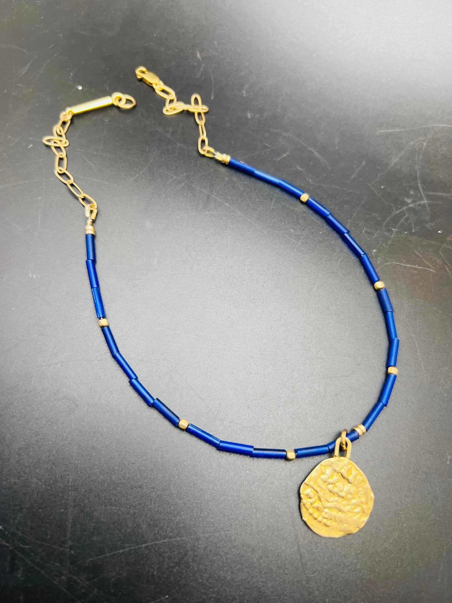 Blue Exile coin necklace