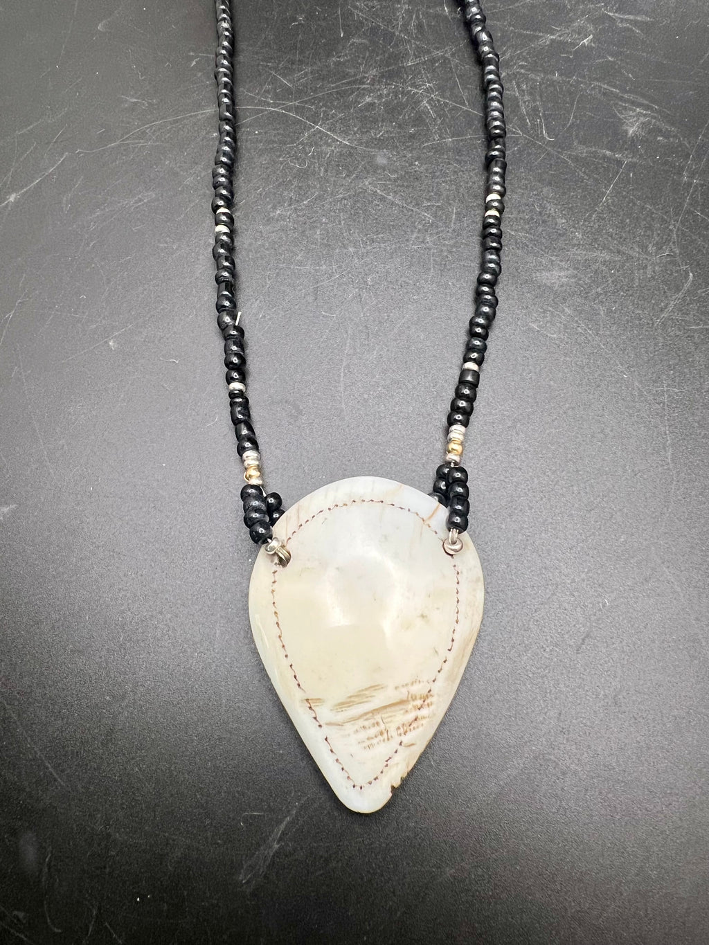 Naga shell pendant