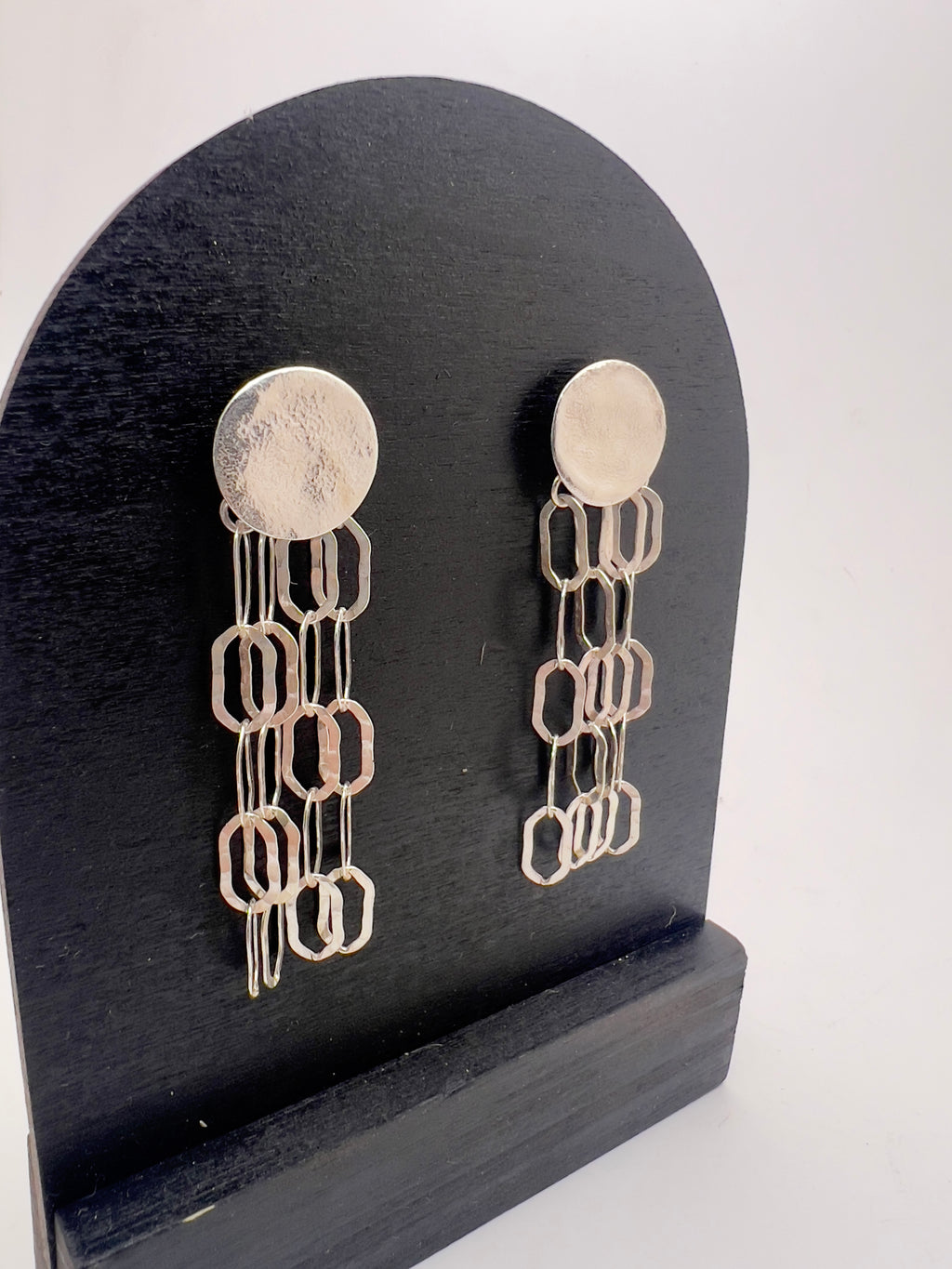 Light chain silver earrings.