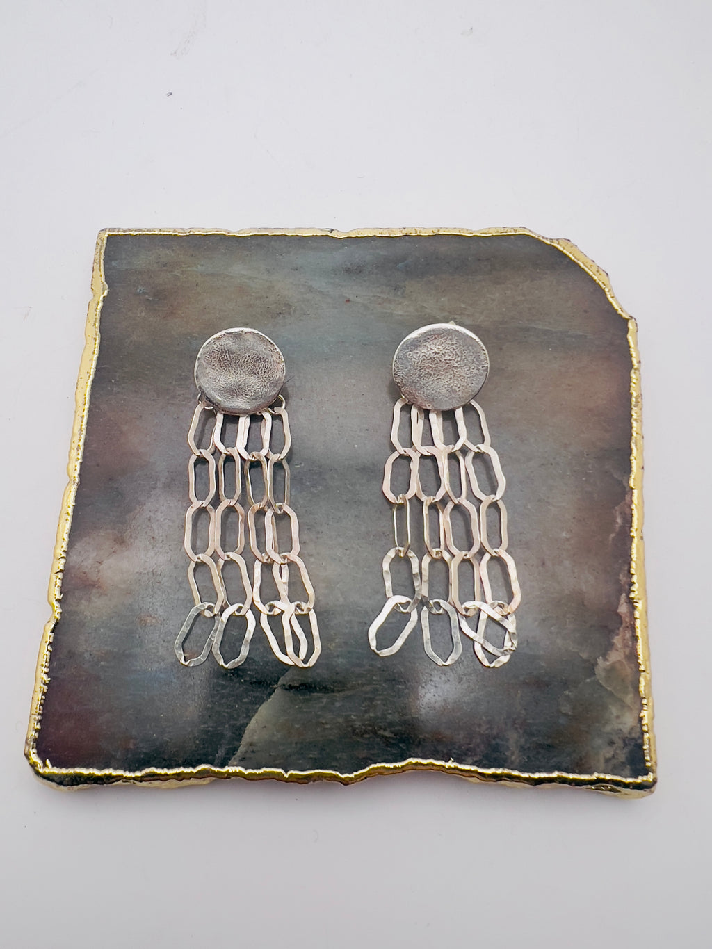 Light chain silver earrings.