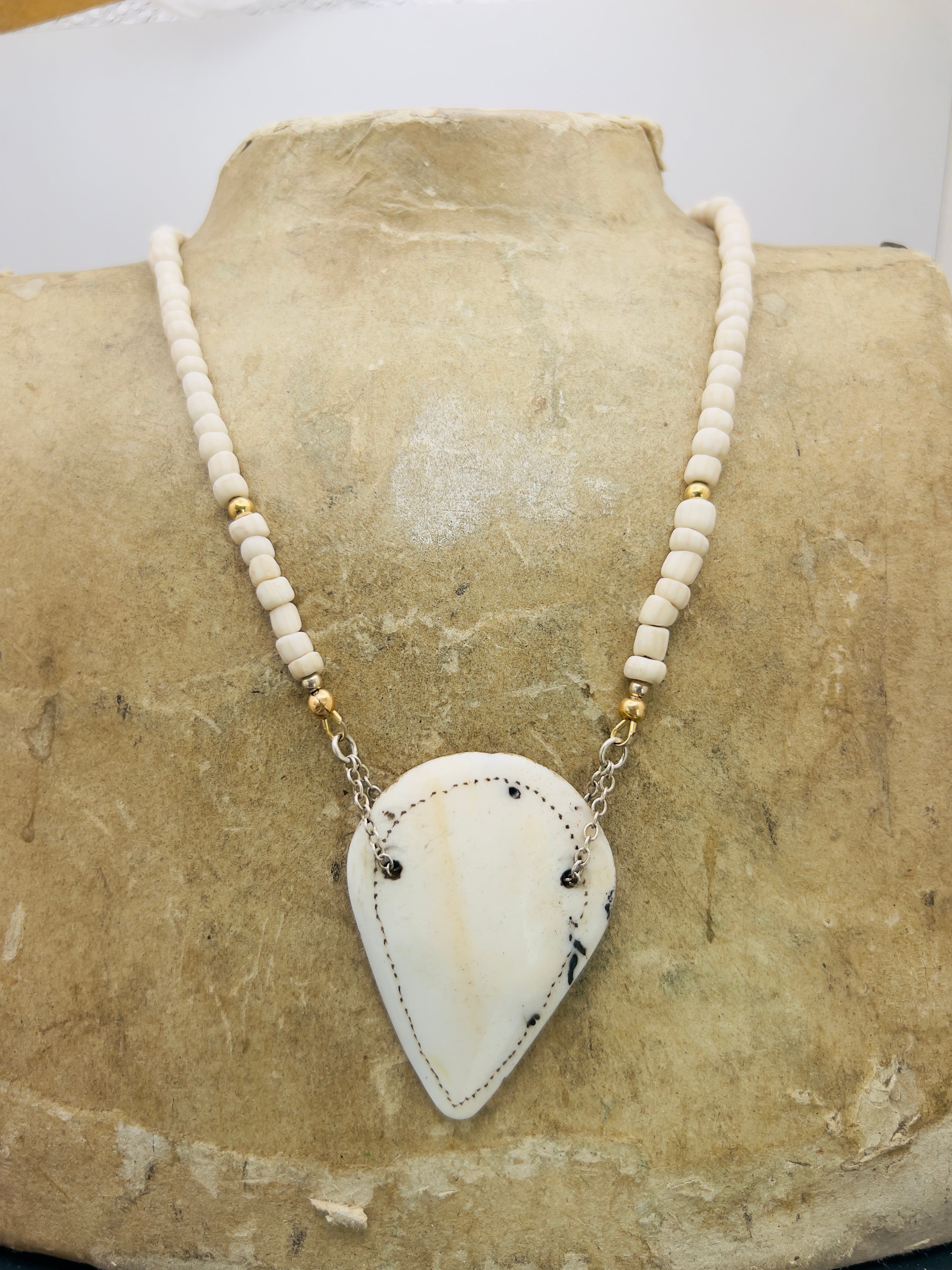 Naga shell pendant