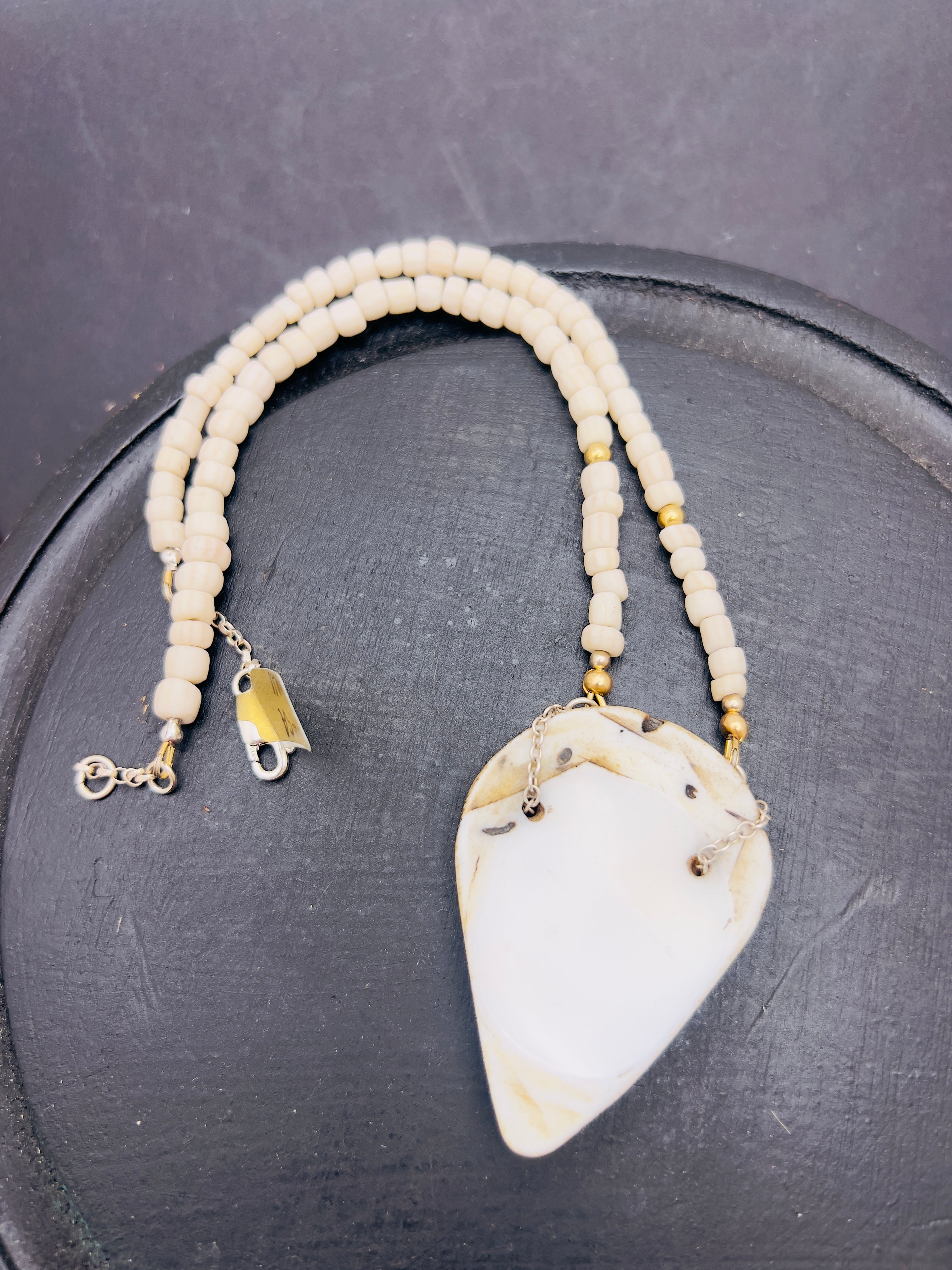 Naga shell pendant