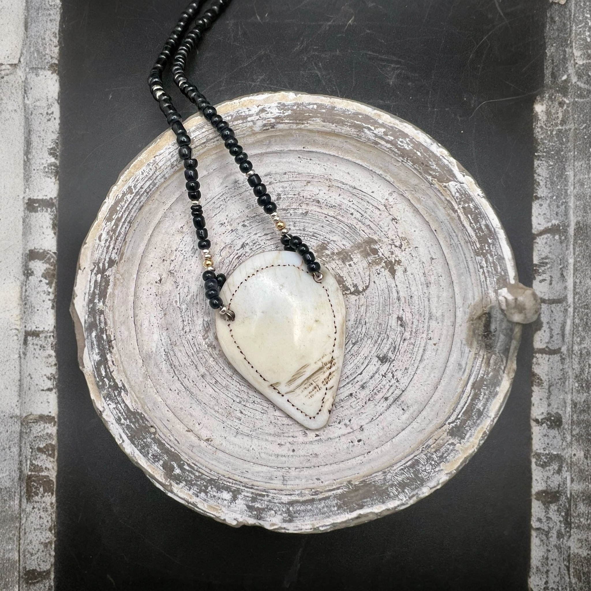 Naga shell pendant