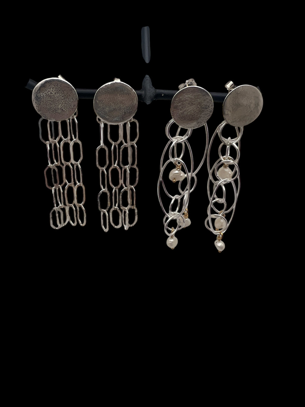 Light chain silver earrings.