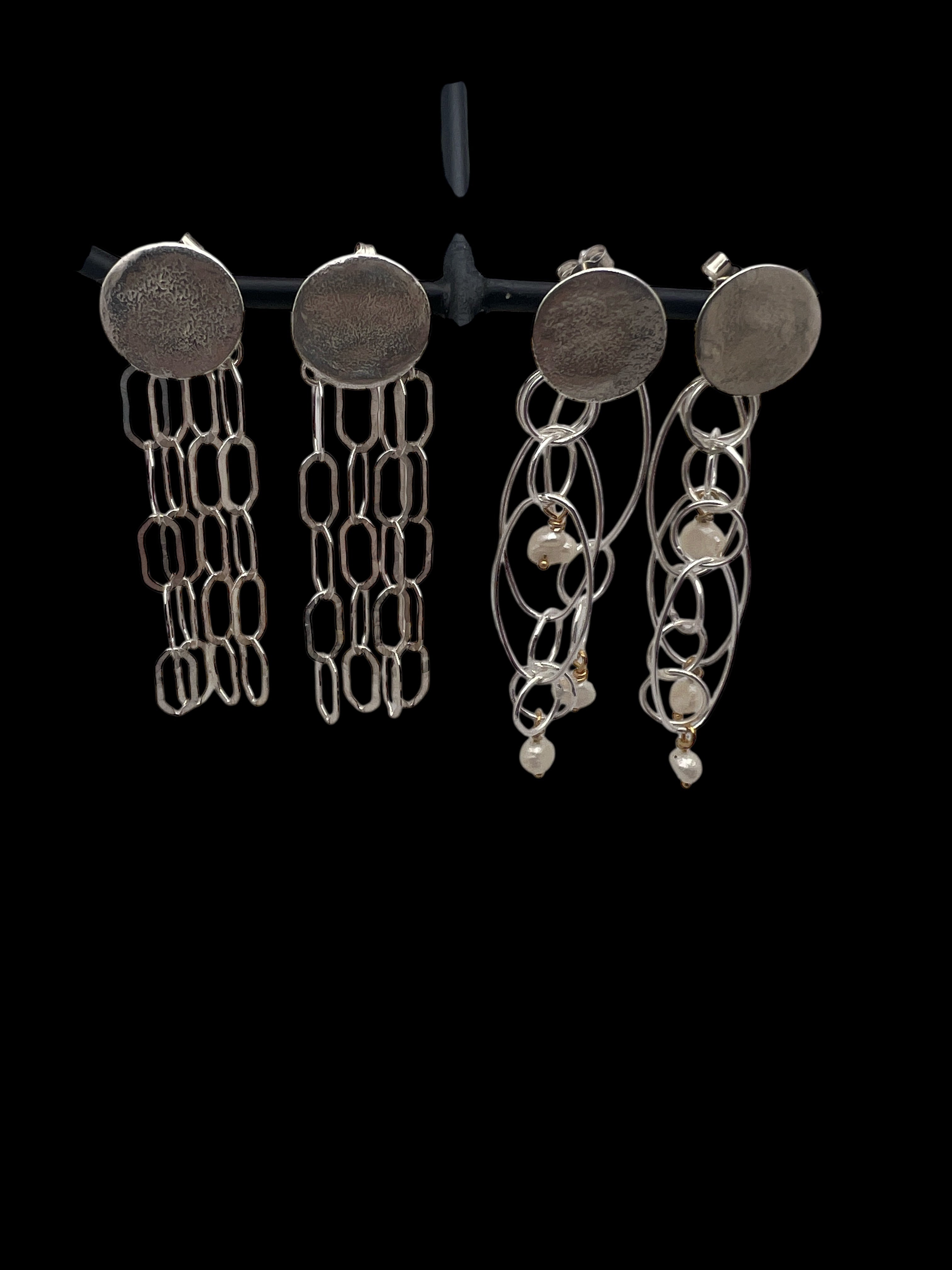 Light chain silver earrings.