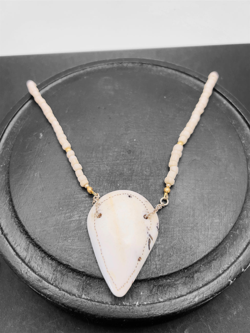 Naga shell pendant