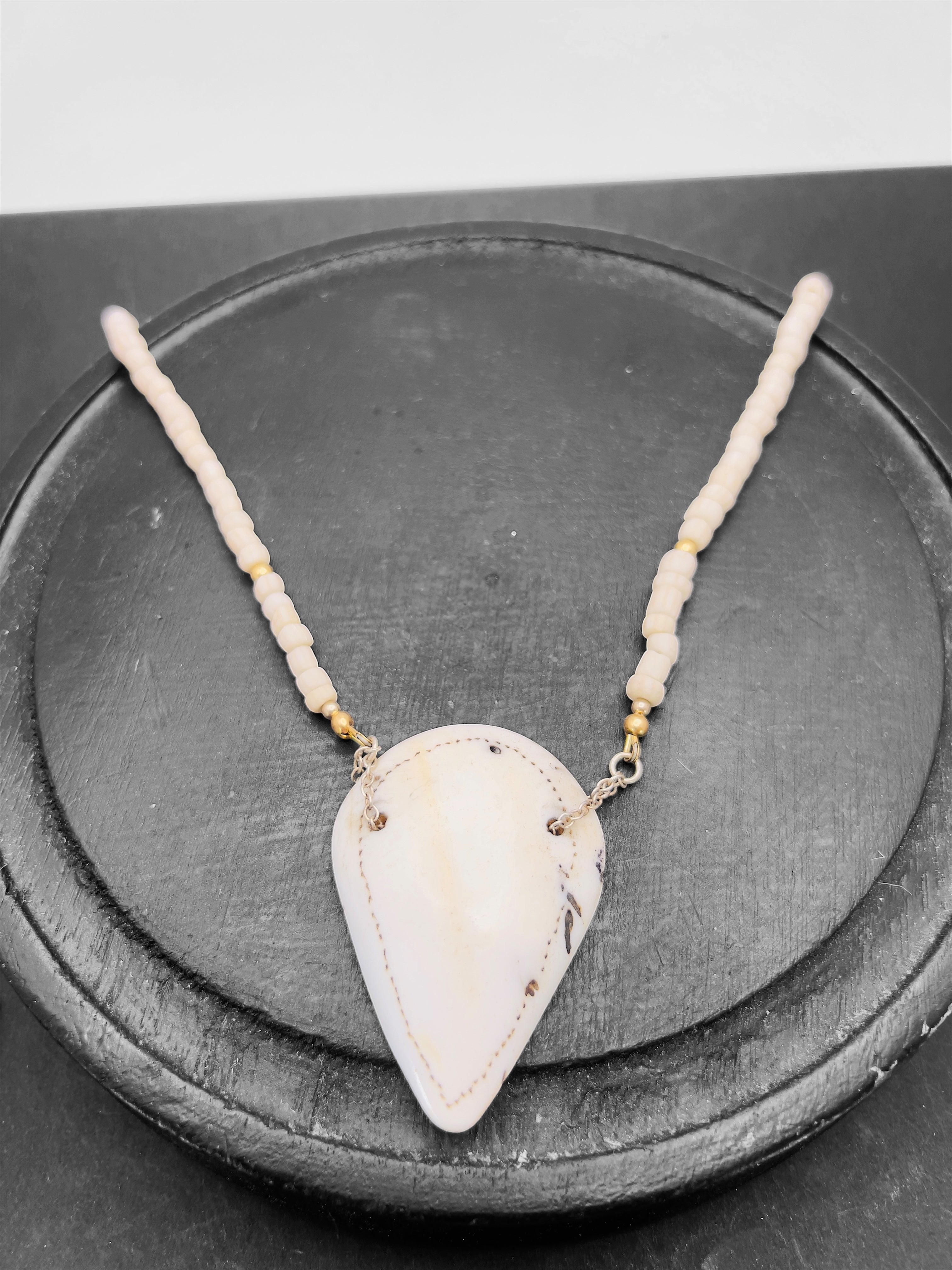 Naga shell pendant