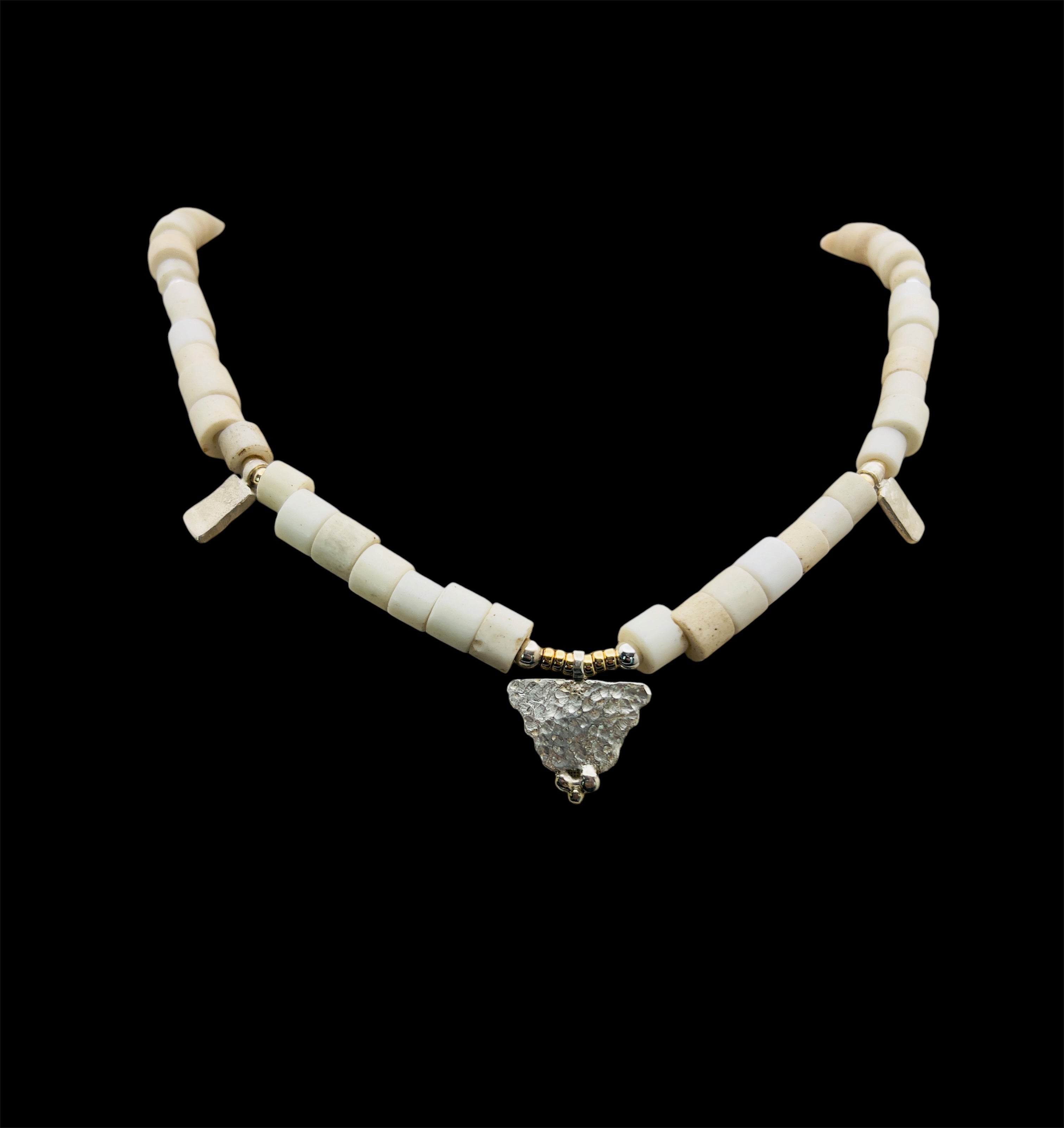 Porcelain trade beads with silver and gold.