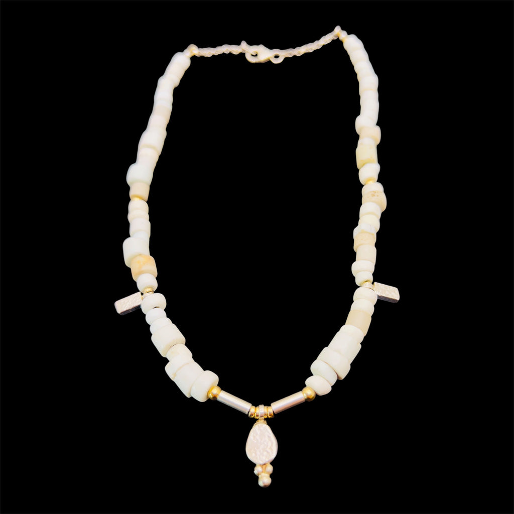 Porcelain trade beads with silver and gold.